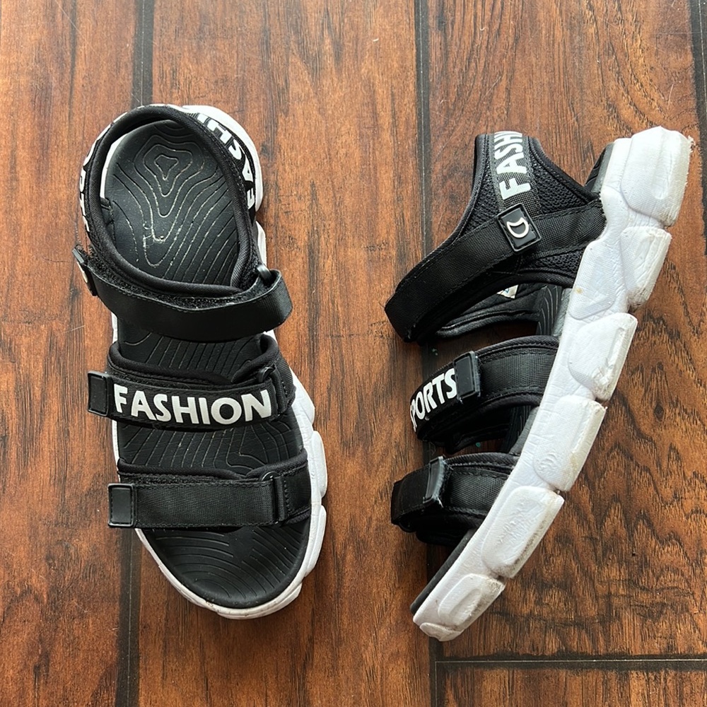Black and white boy sandals with Velcro closures